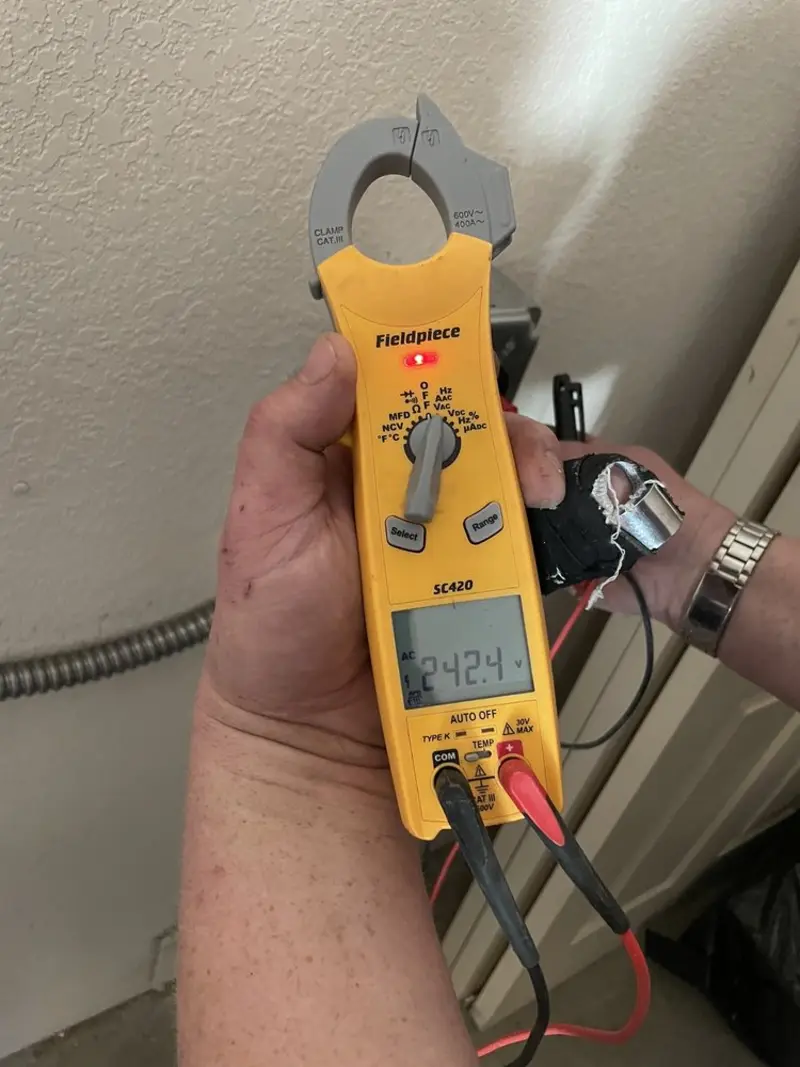 Voltage testing with clamp meter during Electrical Installation Services in La Feria